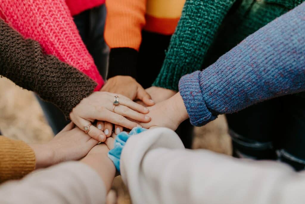 All hands together stock image