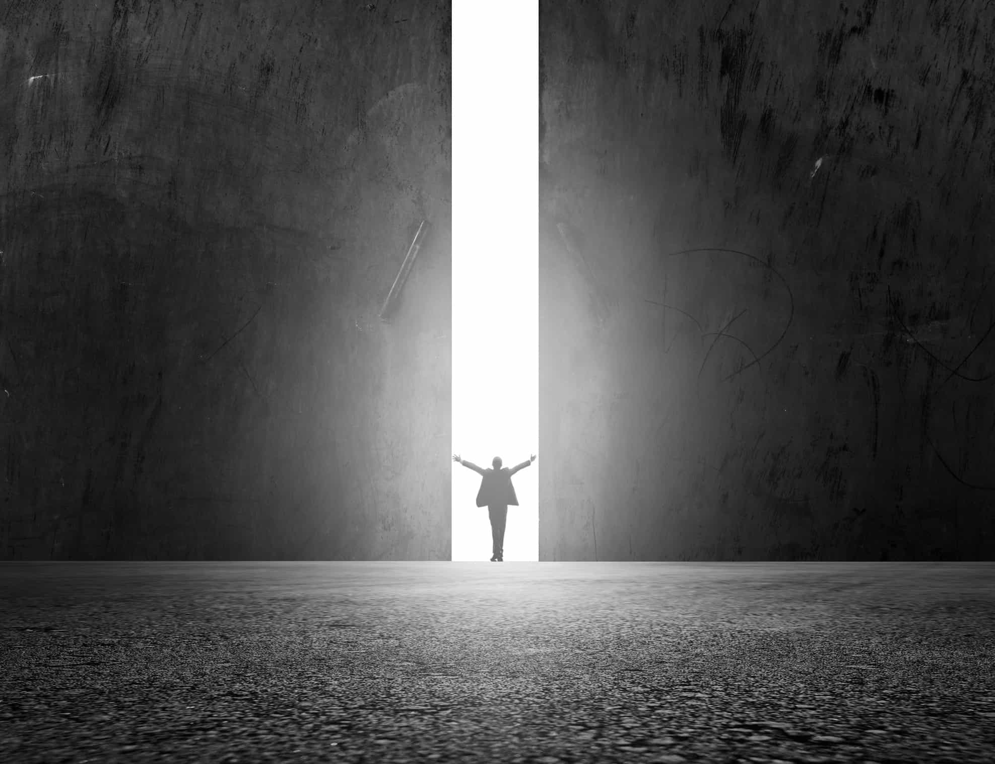 Man stands in the light of opening